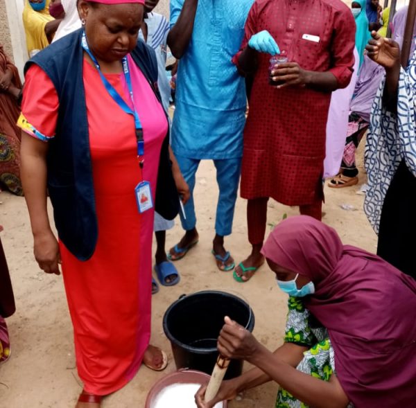 3. participants demonstrating mixing of chemicals for soap production-a