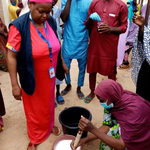 3. participants demonstrating mixing of chemicals for soap production-a